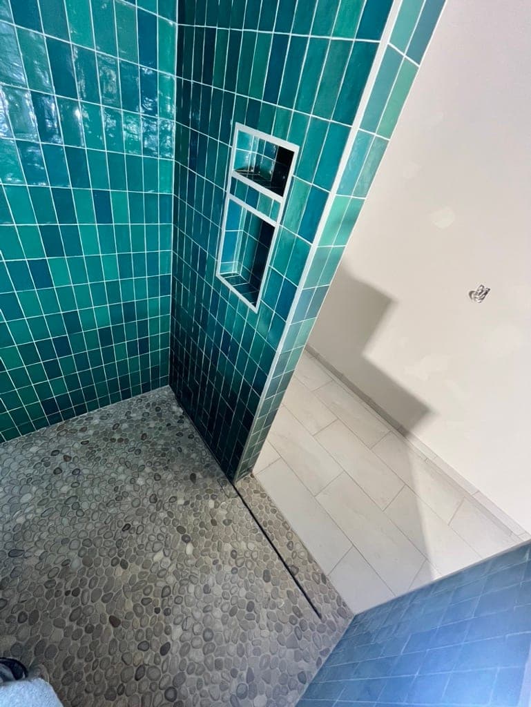 Green Square Tile Shower with Pebble Floor