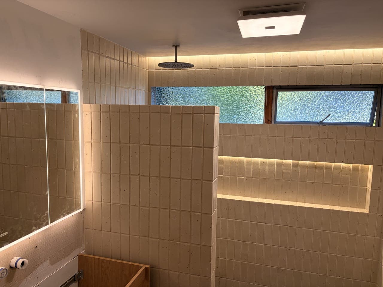 Vertical-Stack Shower with a Lit Full-Length Niche